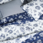 A John Robshaw Cinde Indigo Organic Sheet Set bed with a paisley pattern. - 28362850238510