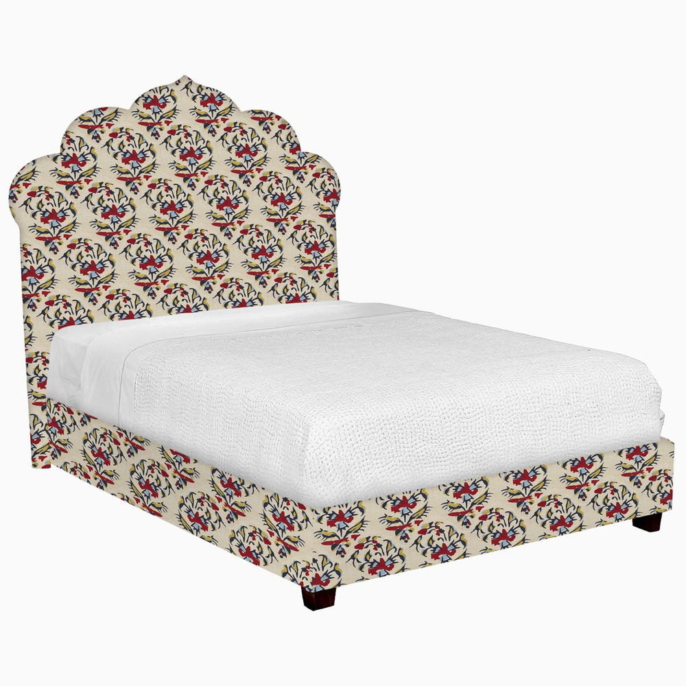 A John Robshaw Custom Bihar Bed with a floral patterned headboard and footboard.
