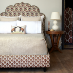 A Vivada Sand Woven Quilt by Quilts & Coverlets, with hand stitching creating a patterned headboard. - 30262782394414
