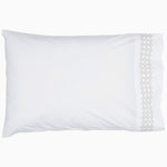 A Sana Light Gray Organic Sheet Set pillow with a hand embroidery gold trim from Sheets & Cases. - 28739479240750