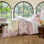 A reversible Vivada Blush Woven Quilt from Quilts & Coverlets with hand-stitched arched windows. - 28783183724590