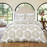 A bed with a Sana Light Gray Organic Sheet Set comforter and pillows made from organic cotton. - 28795946500142