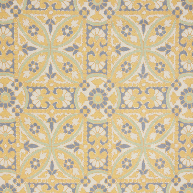A John Robshaw Oman Marigold Fabric rug with an ornate design in yellow and blue.