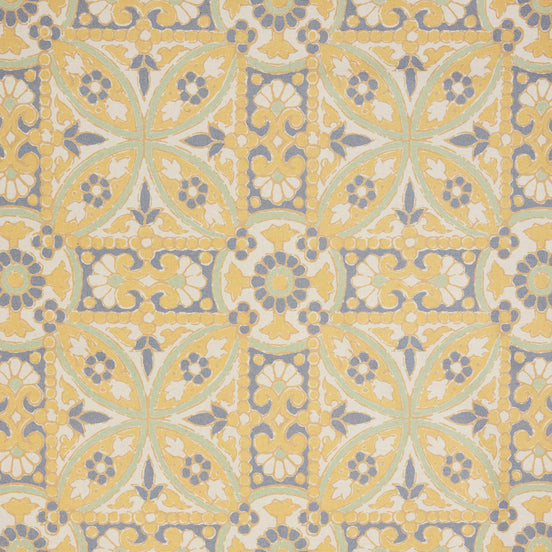 A John Robshaw Oman Marigold Fabric rug with an ornate design in yellow and blue.