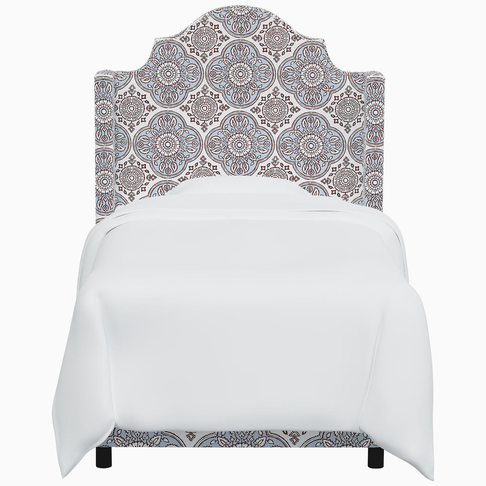 The John Robshaw Samrina bed features an ornate headboard inspired by Mughal arches.