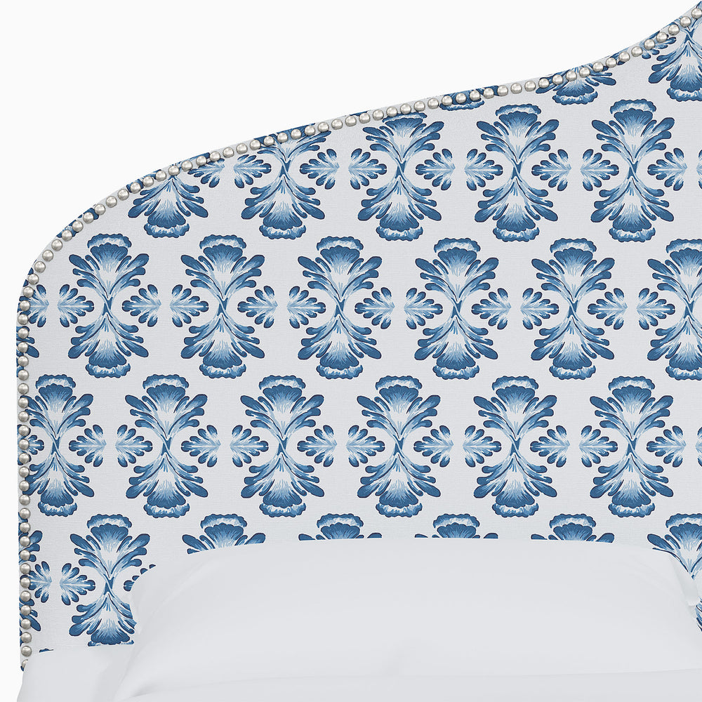 a John Robshaw Alina Headboard with blue and white floral prints.