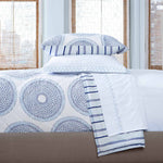 A Lapis Quilt bed with blue and white bedding made of cotton voile fabric, handcrafted by Quilts & Coverlets. - 5686136930350