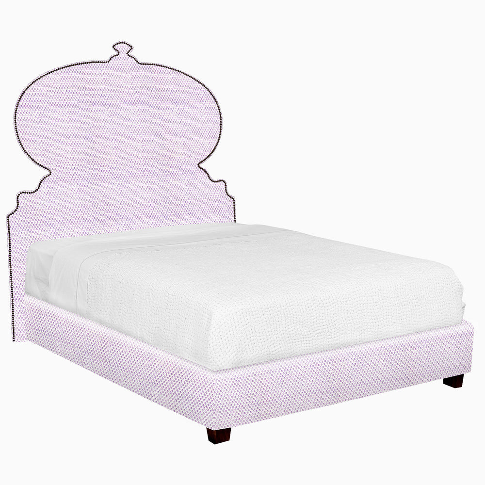 A Custom Orissa Bed with a purple headboard and footboard, available for shipping by John Robshaw.