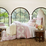 A pink and white bedroom with Dasati Lotus Duvet Set from Duvets & Shams and arched windows. - 28851244531758