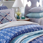 A John Robshaw hand stitched bed with blue and white Organic Hand Stitched Seaglass Quilt bedding and pillows. - 15564938903598