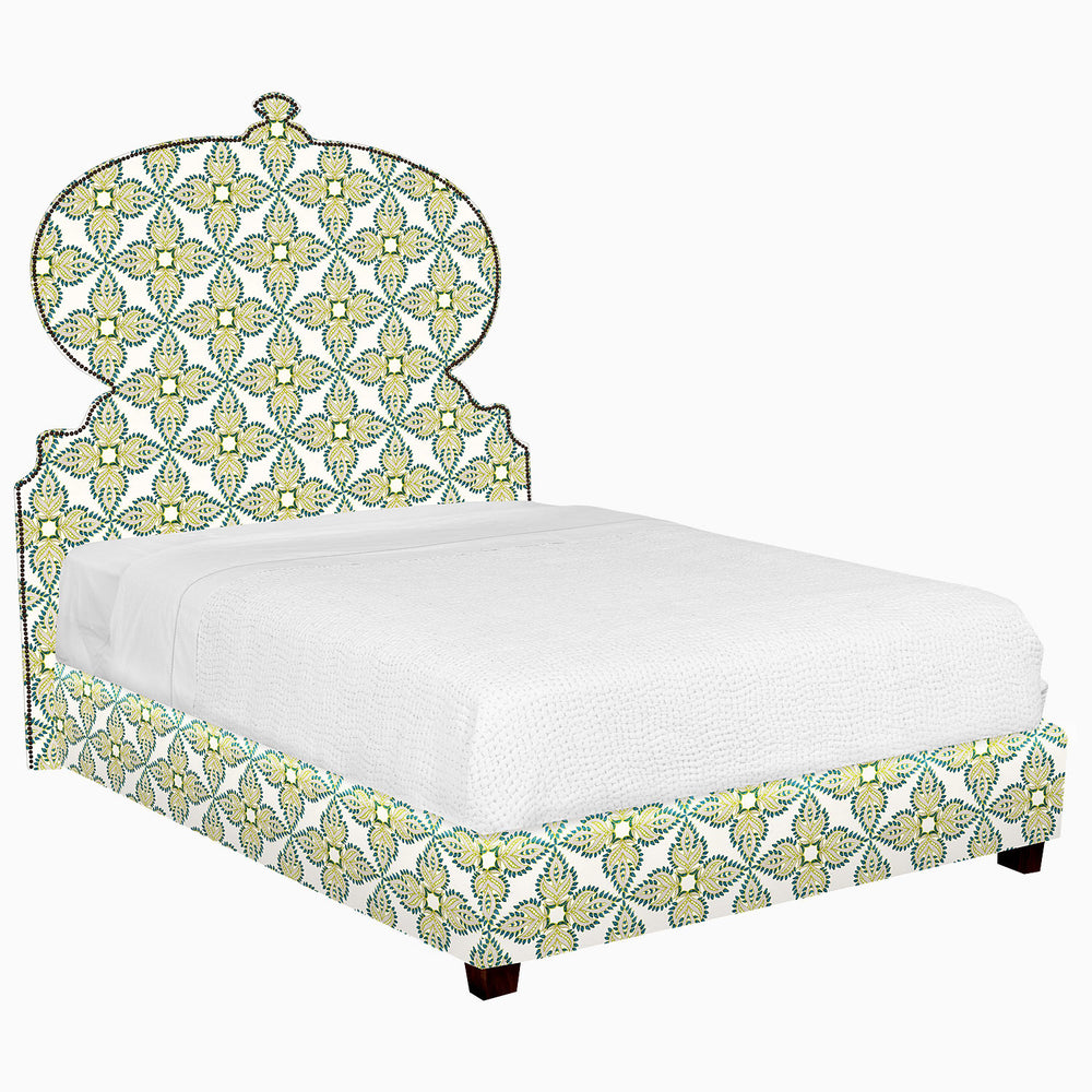 A Custom Orissa Bed by John Robshaw with an ornate headboard and footboard available for white glove delivery.