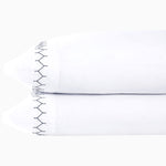 A pair of John Robshaw Stitched Ink Organic Sheets with black embroidered designs. - 30273364262958