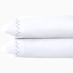 A pair of Stitched Light Indigo Organic Sheets with blue embroidery stitching from John Robshaw. - 30252477841454