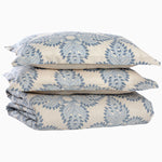 A stack of blue and white Dasati Duvet Set pillows on top of each other, by John Robshaw. - 30253883359278