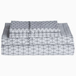 A stack of grey and white John Robshaw Kama Gray Organic Sheet Set. - 30253884768302