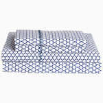 A Kesar Indigo Organic Sheet Set by John Robshaw, featuring blue and white colors with an organic cotton fabric adorned with a geometric pattern. - 30253940604974