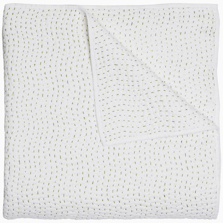 A John Robshaw Organic Hand Stitched Moss Quilt with hand stitched, gold dots on it.