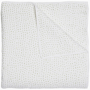 A John Robshaw Organic Hand Stitched Moss Quilt with hand stitched, gold dots on it.
