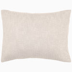 A white pillow with a Vivada Sand Woven Quilt coverlet by John Robshaw on a white background. - 28348602056750