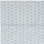 An organic cotton rug with circles in a Kama Light Indigo Organic Sheet Set design by John Robshaw. - 28202300244014