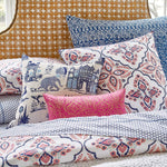 A bed with Kesar Indigo Organic Sheet Set bedding and pillows by John Robshaw. - 5731098460206