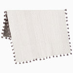 A white and grey cotton chambray Sahati Charcoal Throw rug with tassels. - 28455932788782