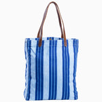 A Vintage Stripe Tote Bag by John Robshaw, featuring blue and white stripes and leather handles. - 30253964689454