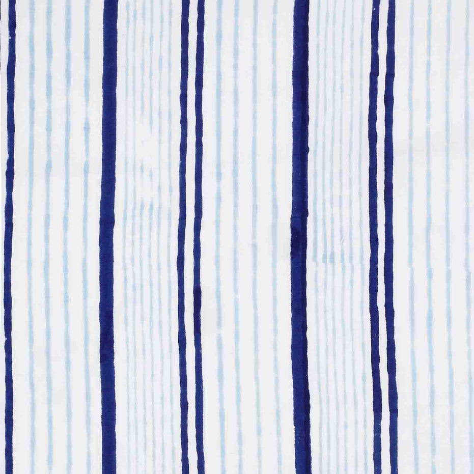 A Lapis Quilt by John Robshaw, handcrafted look blue and white striped fabric.