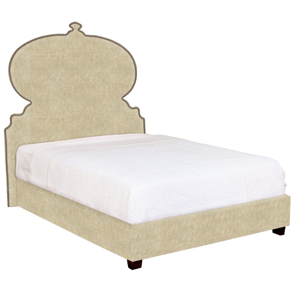 An ornate beige upholstered John Robshaw Custom Orissa Bed with a headboard, available for white glove delivery.