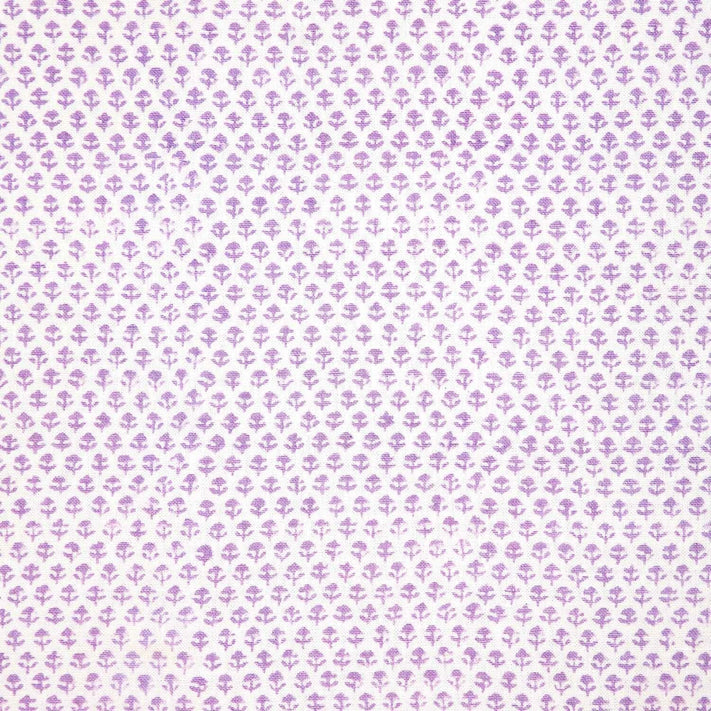 A Bindi Lavender Fabric with a purple and white polka dot pattern on a white background featuring traditional craftsmanship by John Robshaw.