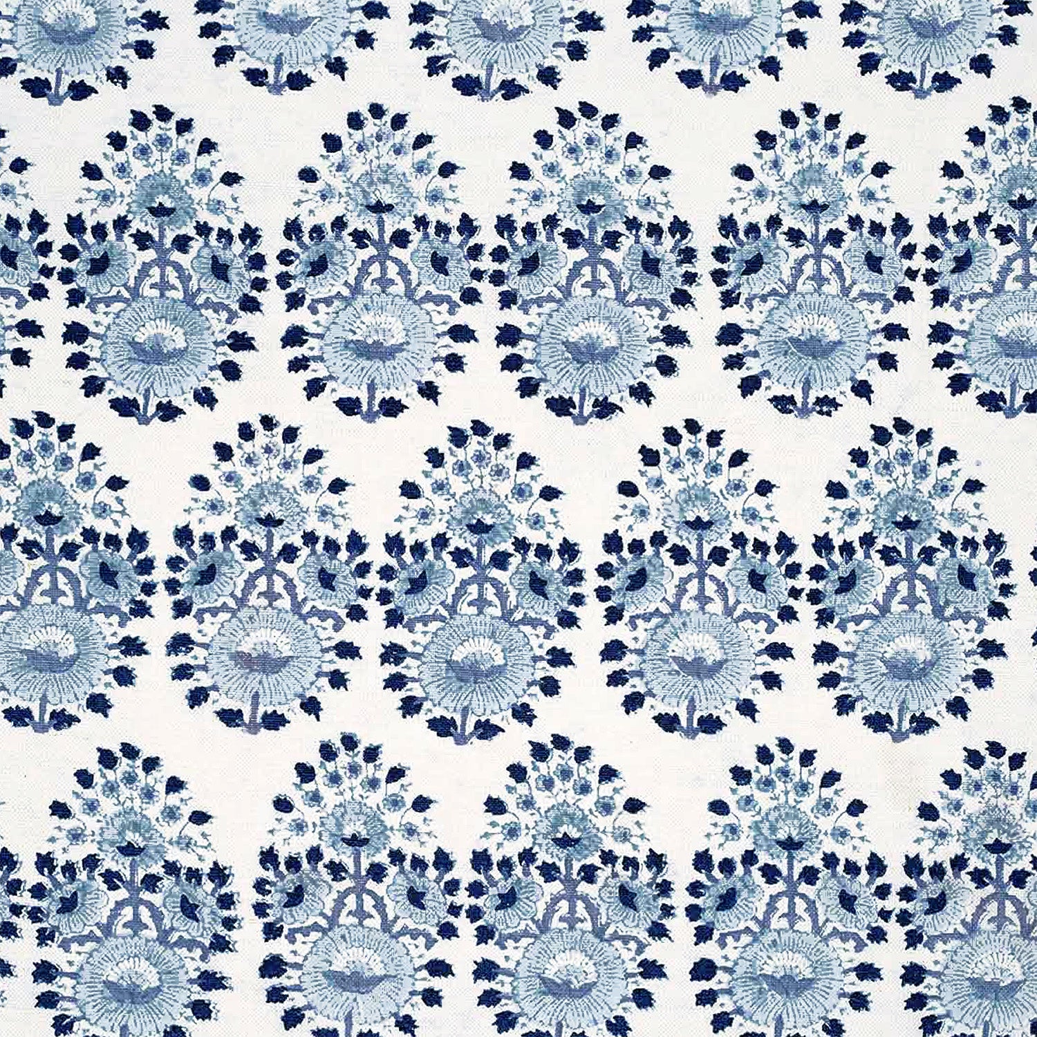 A blue and white floral pattern on a white background, created through traditional craftsmanship using Lanka Lapis Fabric by John Robshaw.