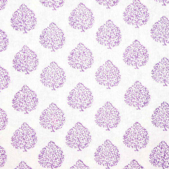 A purple and white Mali Lavender Fabric with trees on it, showcasing skilled artisans' traditional craftsmanship from John Robshaw.