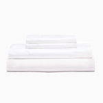 Three Stitched White Organic Sheets by Sheets & Cases stacked on top of each other, hand embroidered with organic cotton percale. - 30252493242414